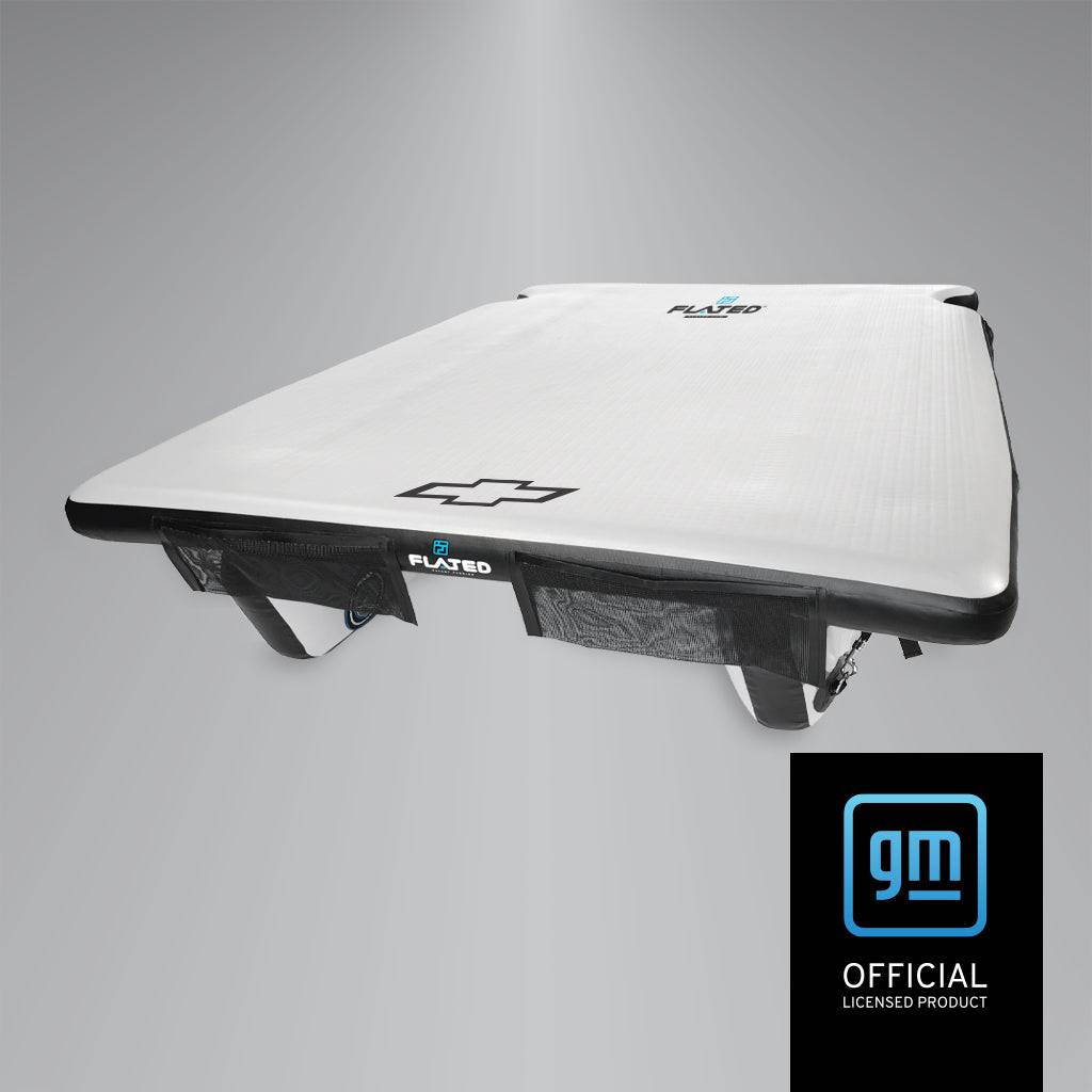 A rectangular white FLATED FULL-SHORT DECK56 SILVERADO floating platform features a Chevrolet logo and the word PLAYED. A “GM Official Licensed Product” logo appears at the bottom right on a black background.
