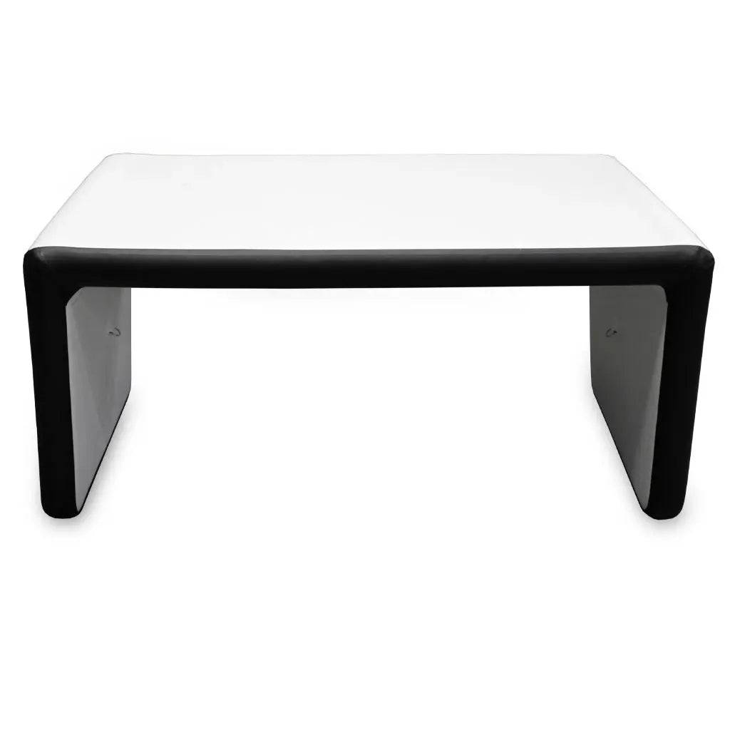 The FLATED MID-SIZE TABLE60 features a modern, portable design with a white top and thick black edges, supported by two solid side panels—perfect as a sleek camping table for contemporary settings.