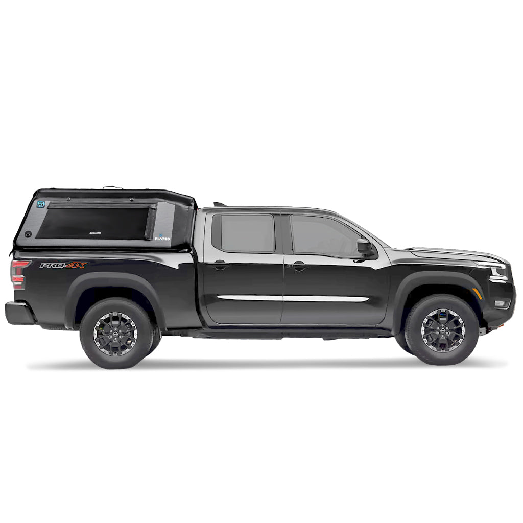 A blue pickup truck with a FLATED MID-LONG MR60 black and gray Air-Topper inflatable shell mounted over the bed. The tent is closed, highlighting a side window and branded logos on its durable fabric.