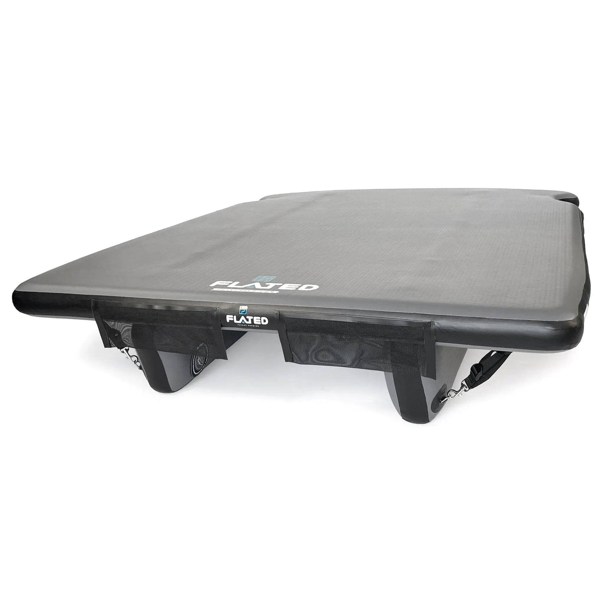 The FLATED FULL-SHORT DECK56 is a black Air-Deck inflatable dock with three fins and underside straps, branded FLATED on the front. Its flat, rectangular surface is perfect as an inflatable truck bed platform for mobile adventures.
