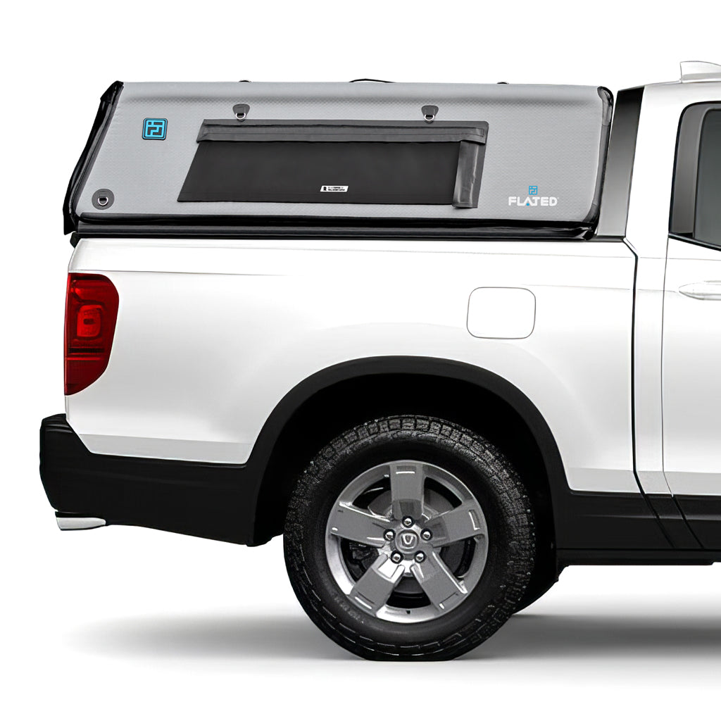 A FLATED MID-SHORT HR CAP53 white pickup truck topper with a rectangular side window, black trim, and branded for outdoor use. This gray camper shell installs easily over the bed without tools.