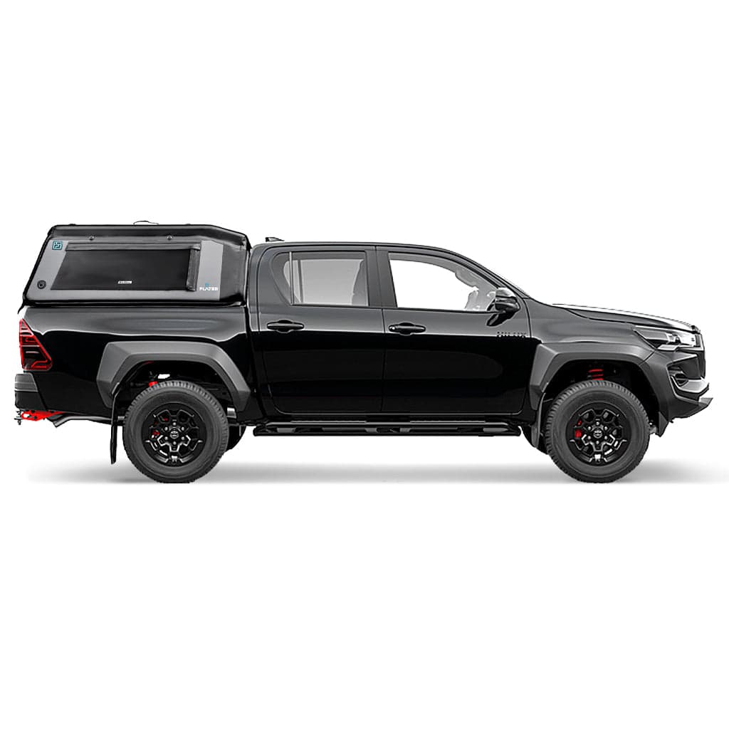 A white pickup truck is fitted with a FLATED MID-SHORT MR411 black and gray Air-Topper inflatable shell, including a side window and secure fastenings, plus sleek black wheels and red accents under the rear bumper.