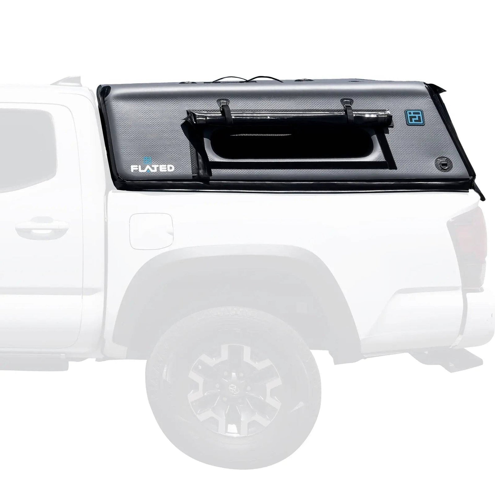 A white pickup with a FLATED MID-SHORT CAP50 (OPEN BOX), a black inflatable truck bed topper, is securely installed and features a side window and latches.