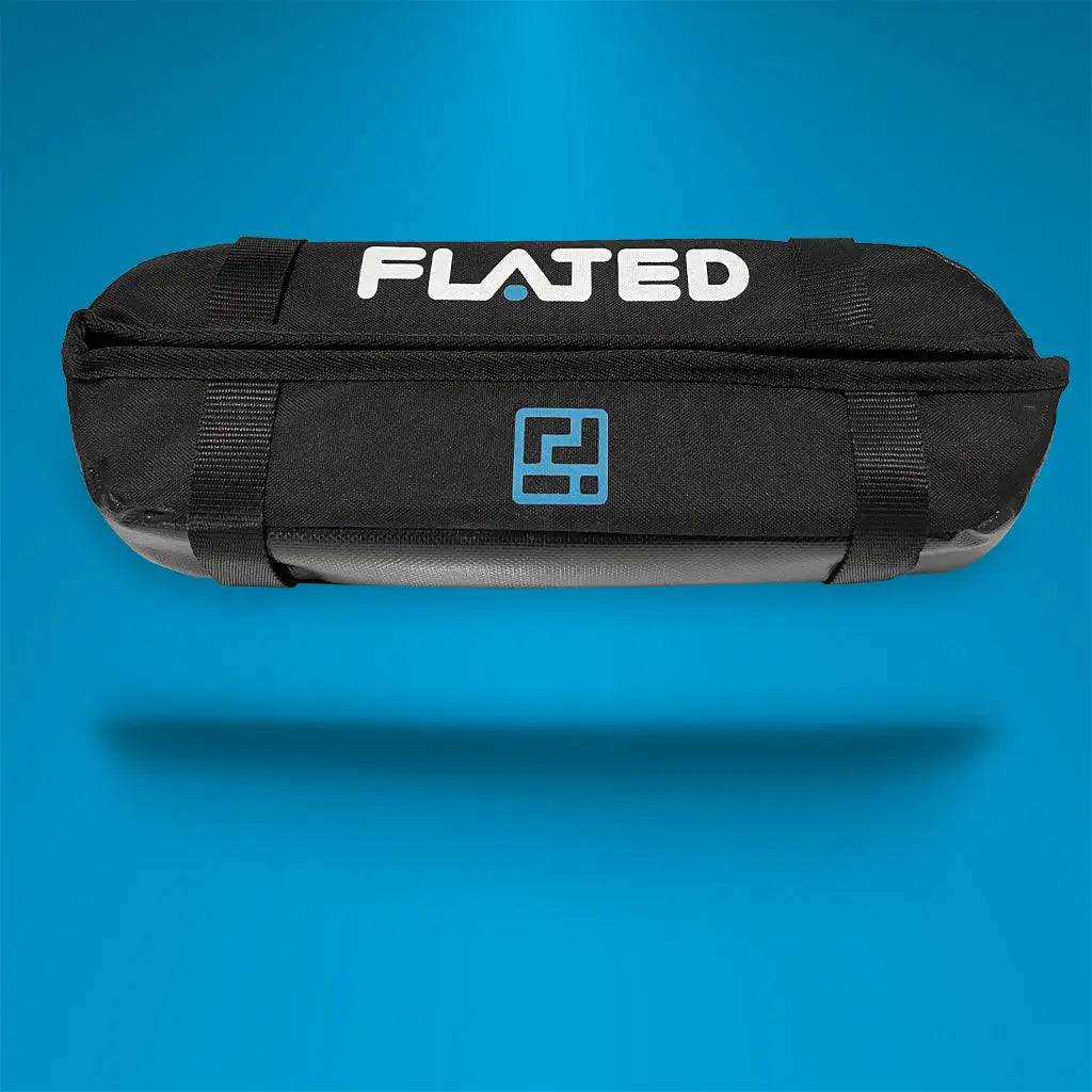 Two black FLATED SOFT RACK SET2 (OPEN BOX) pads, each with the FLATED logo and a blue geometric icon, are displayed on a white background. They fit cross bars and protect your rooftop gear.