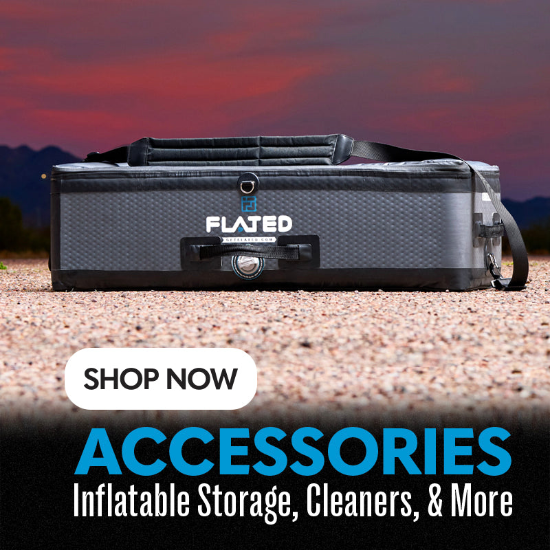 A black and gray FLATED inflatable storage box sits on gravel outdoors at sunset, with mountains in the background. Text reads: “SHOP NOW ACCESSORIES Inflatable Storage, Cleaners, & More.”.