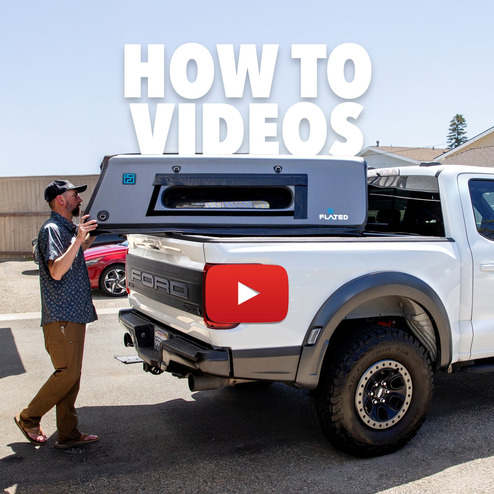 A man stands next to a white Ford pickup truck with a rooftop cargo box on the bed. Large text reads HOW TO VIDEOS above, and a red play button is centered over the trucks tailgate.