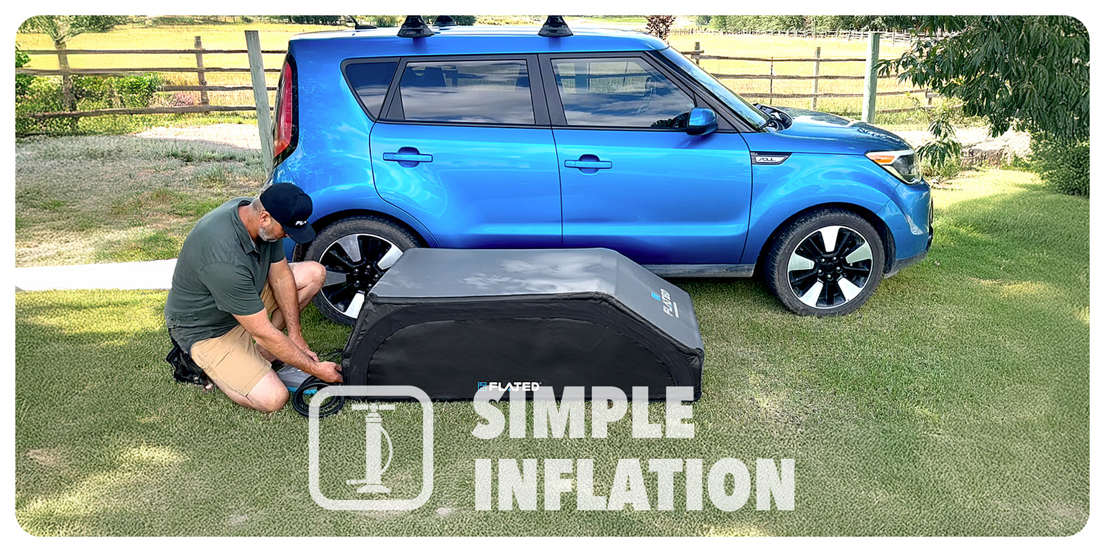 A man kneels on grass beside a blue car, inflating a black rooftop cargo carrier. The text “SIMPLE INFLATION” with an air pump icon is overlaid on the image.