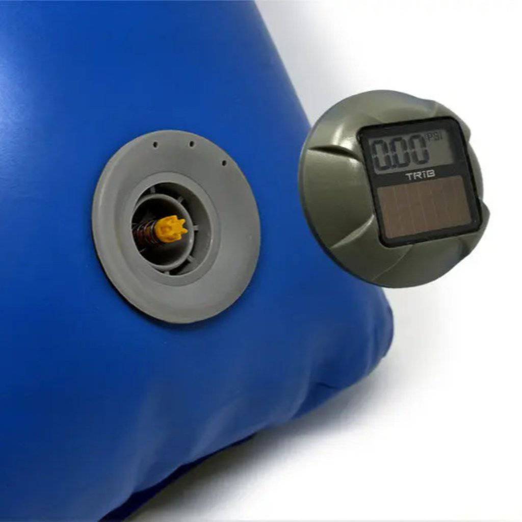 The TRIB airCap HR Digital Pressure Gauge by TRIB features a solar-powered LCD display showing 0.00 PSI, mounted on a round metallic surface. Inset reveals the back view and an inflatable valve connector for easy use.