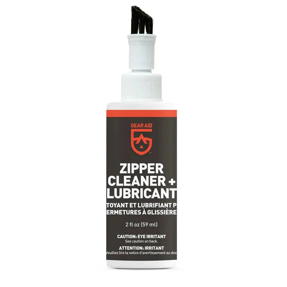 A 2 fl oz (59 ml) bottle of Gear Aid Zipper Cleaner and Lubricant for Air-Carriers and Air-Toppers with a brush cap offers zipper protection, has English and French labels, and cautions that the lubricant is an eye irritant.