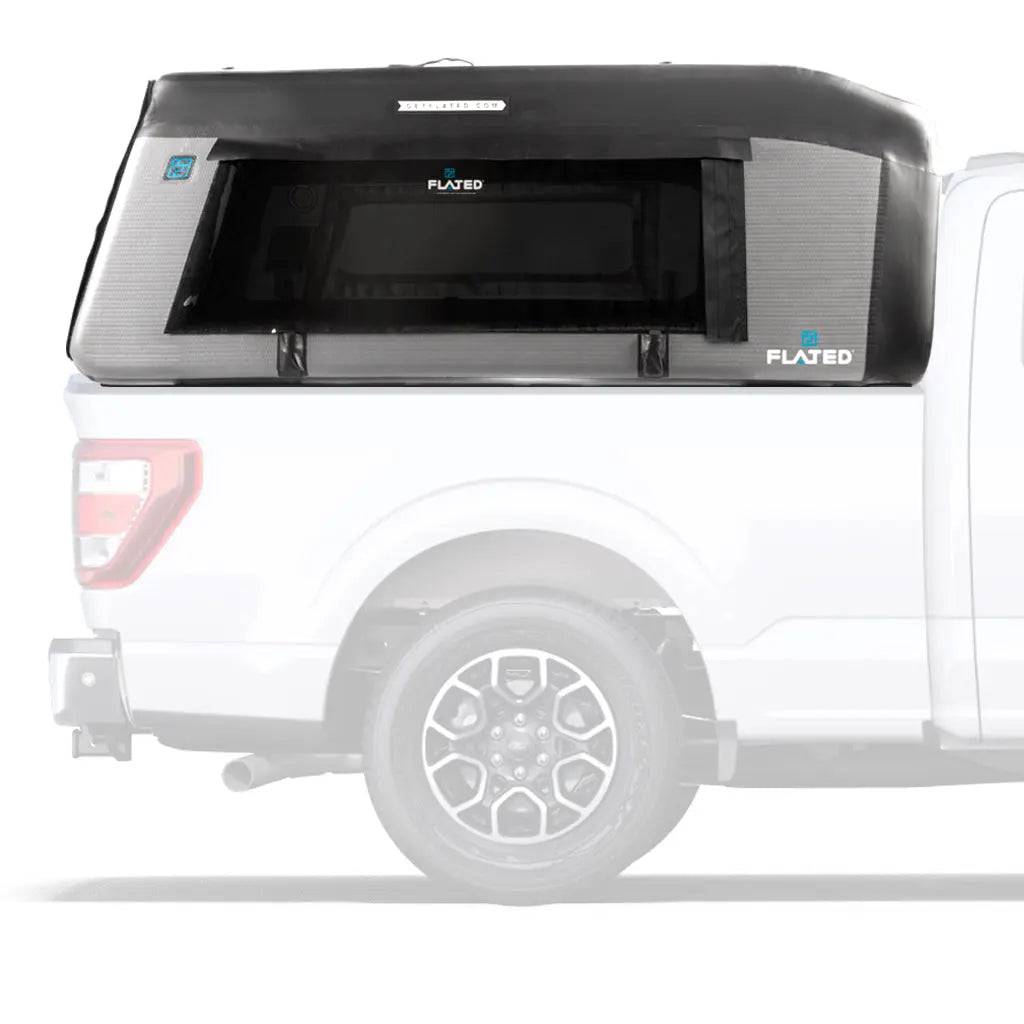 A white pickup truck with a black and gray FLATED FULL-STANDARD MR66 (OPEN BOX) Air-Topper inflatable shell mounted on the bed, shown in profile view against a white background.